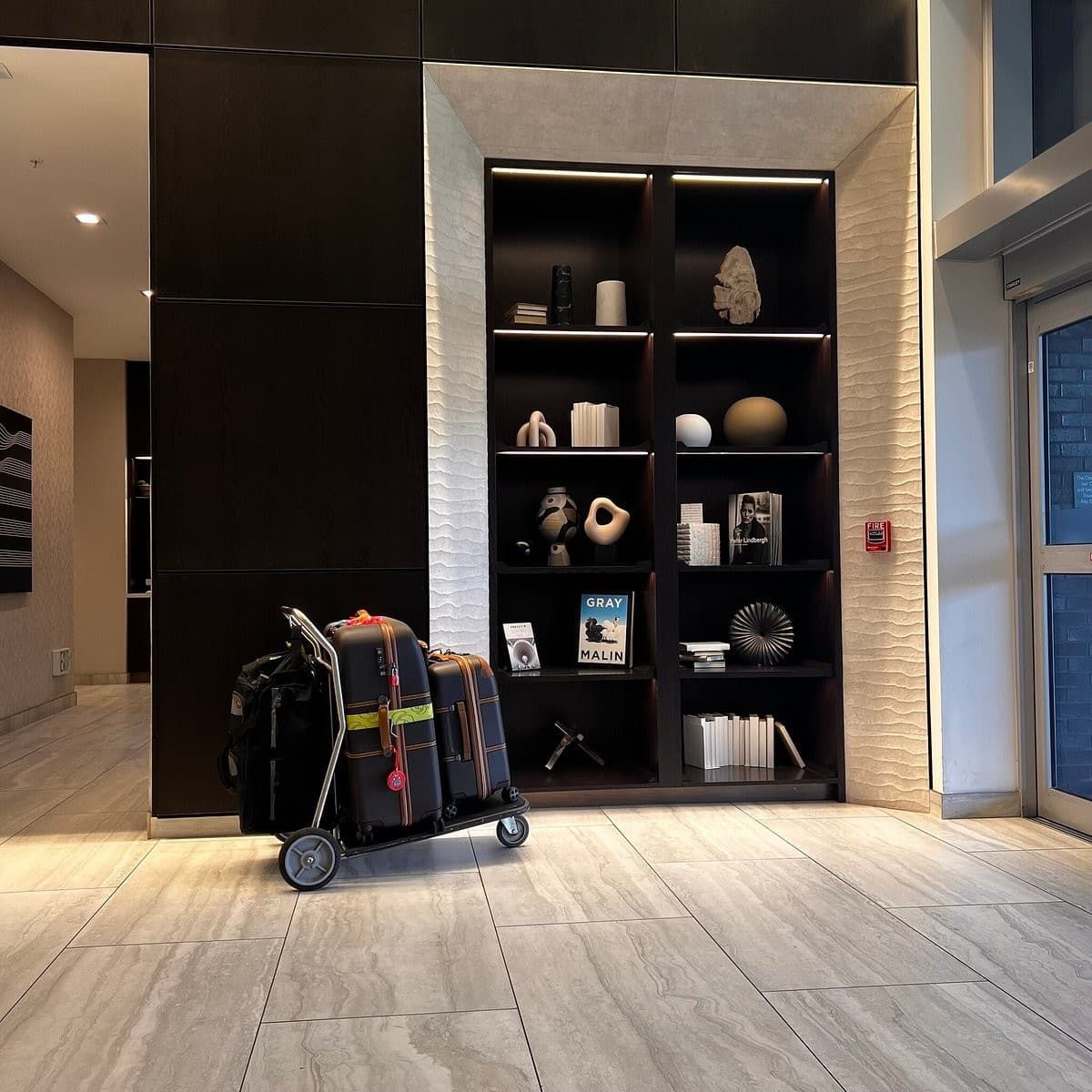 AC Hotel Miami Dadeland lobby area with luggage