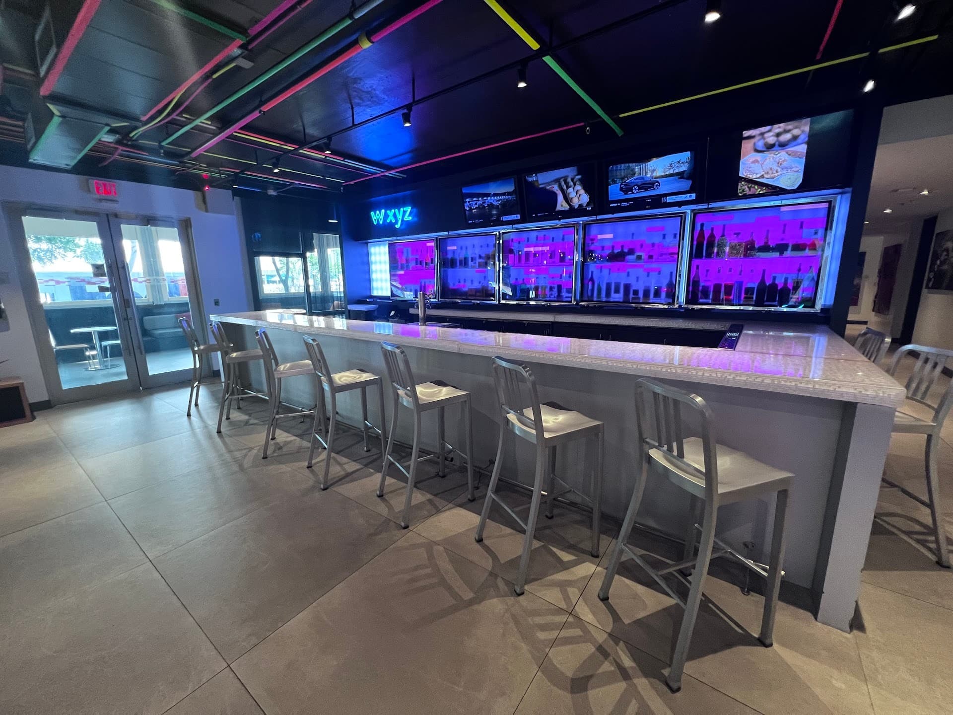Aloft Miami bar area with colorful lights