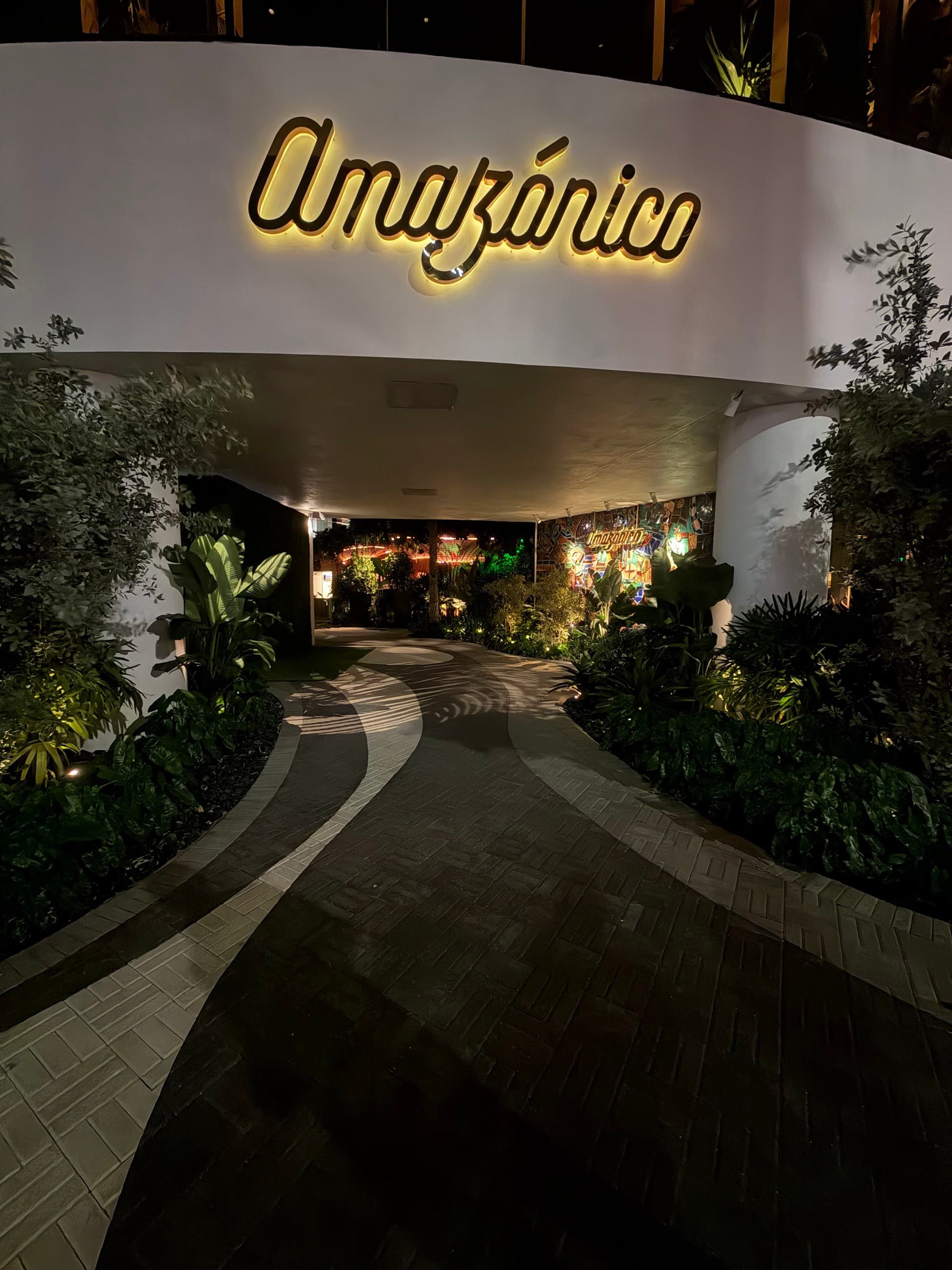 Entrance view of Amazónico Miami restaurant at night