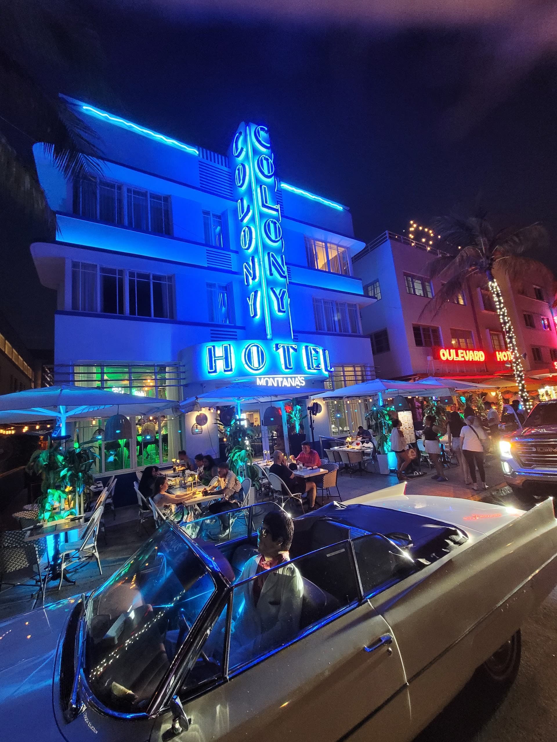 Colony Hotel exterior at night in Miami Beach