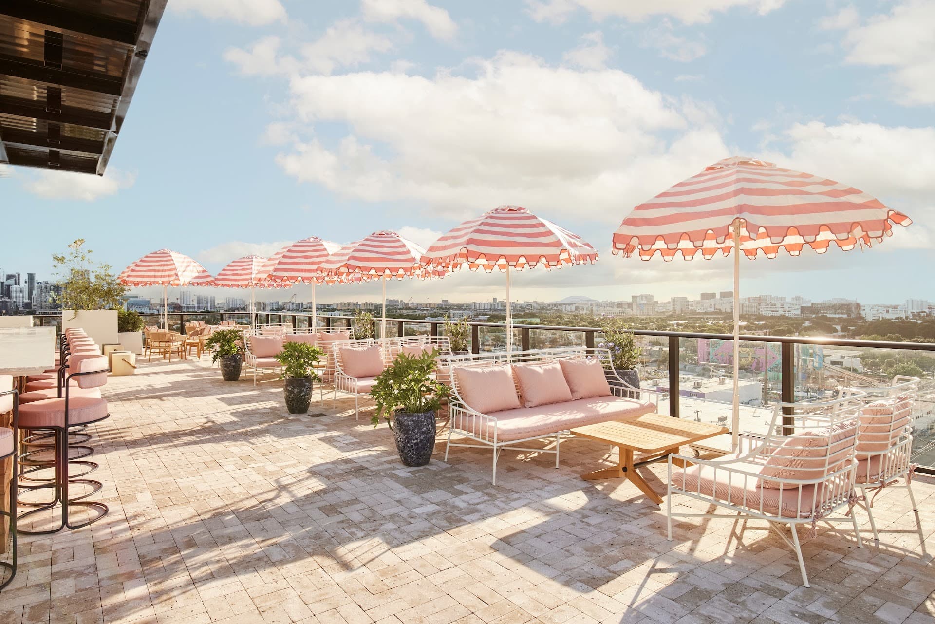 Outdoor patio at ART Wynwood, Miami with striped umbrellas