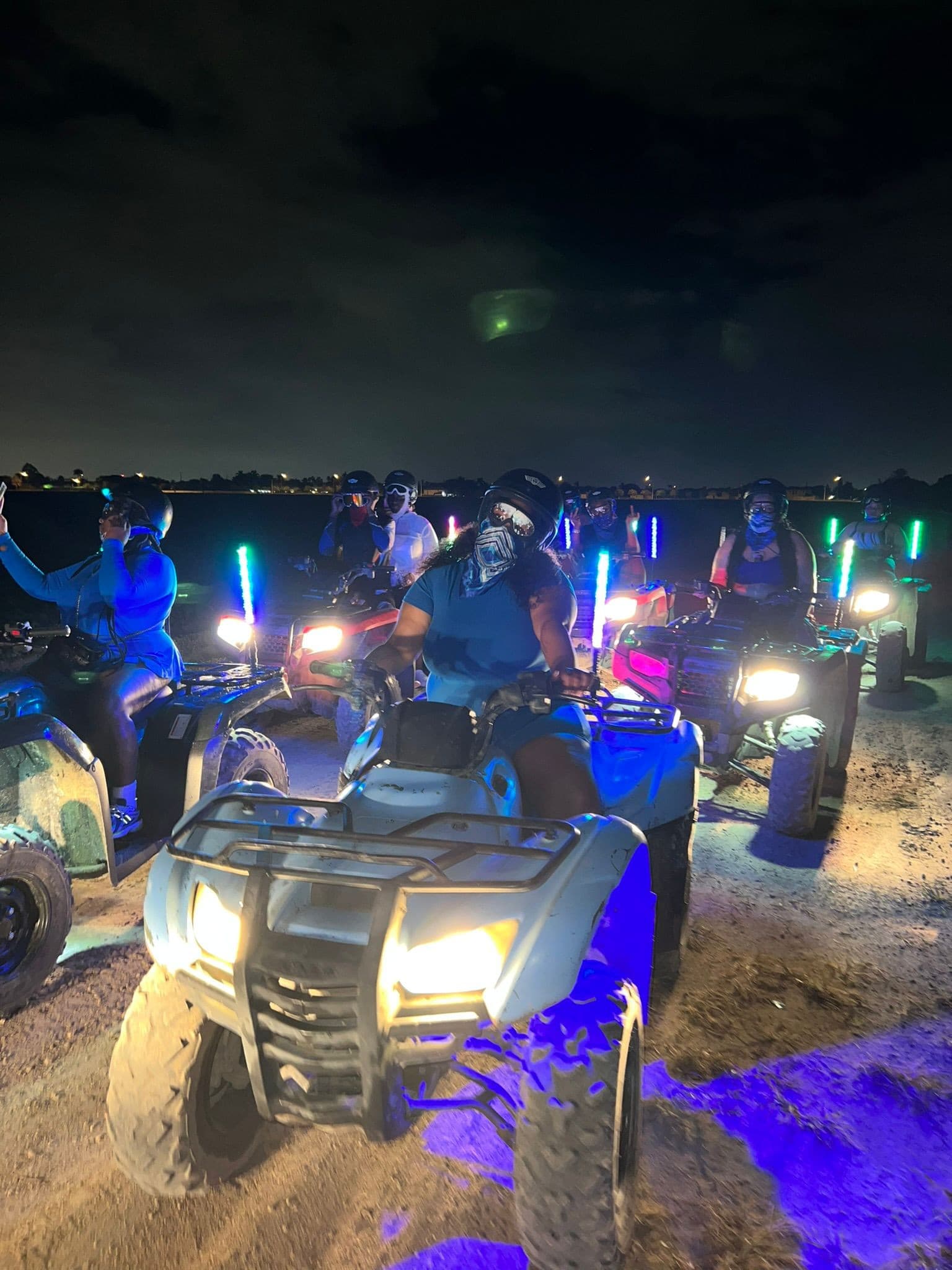 ATV of Miami night ride with illuminated vehicles