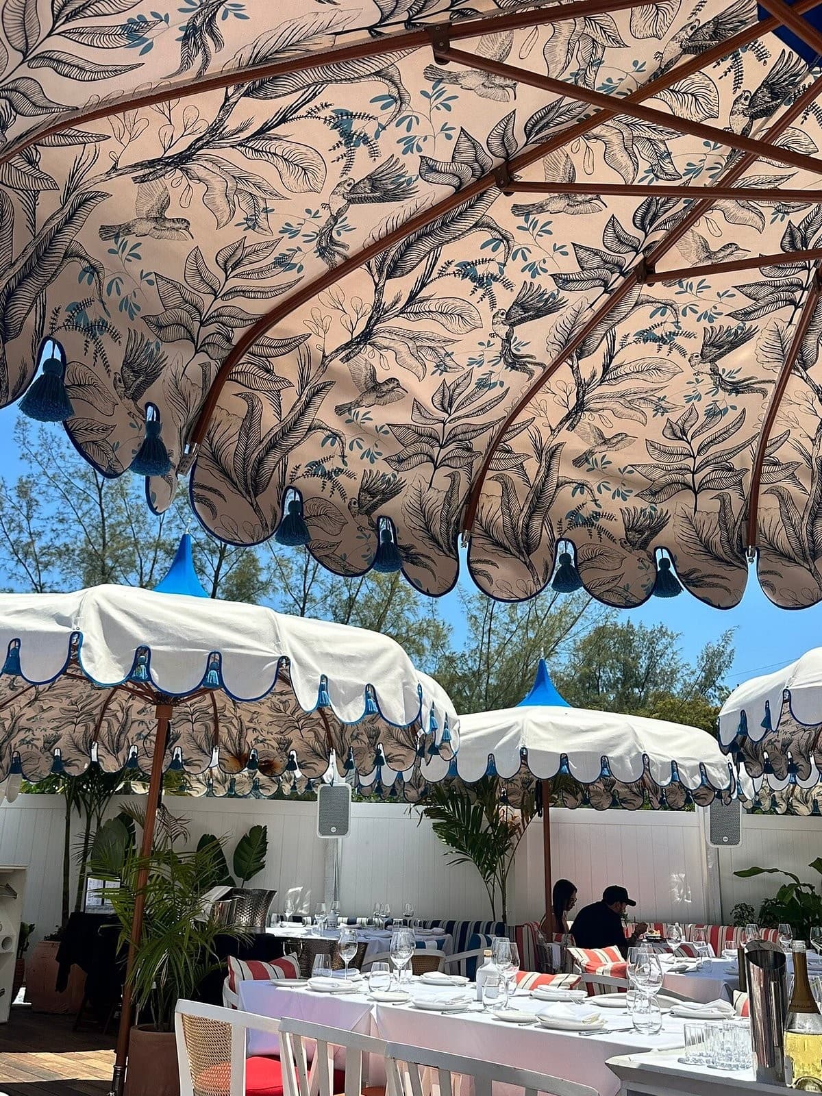 Bagatelle Miami River dining area with unique umbrellas