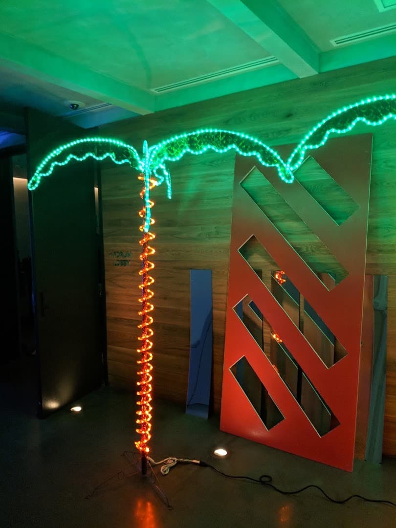 Neon palm tree decor at Basement Bowl & Skate Miami Beach
