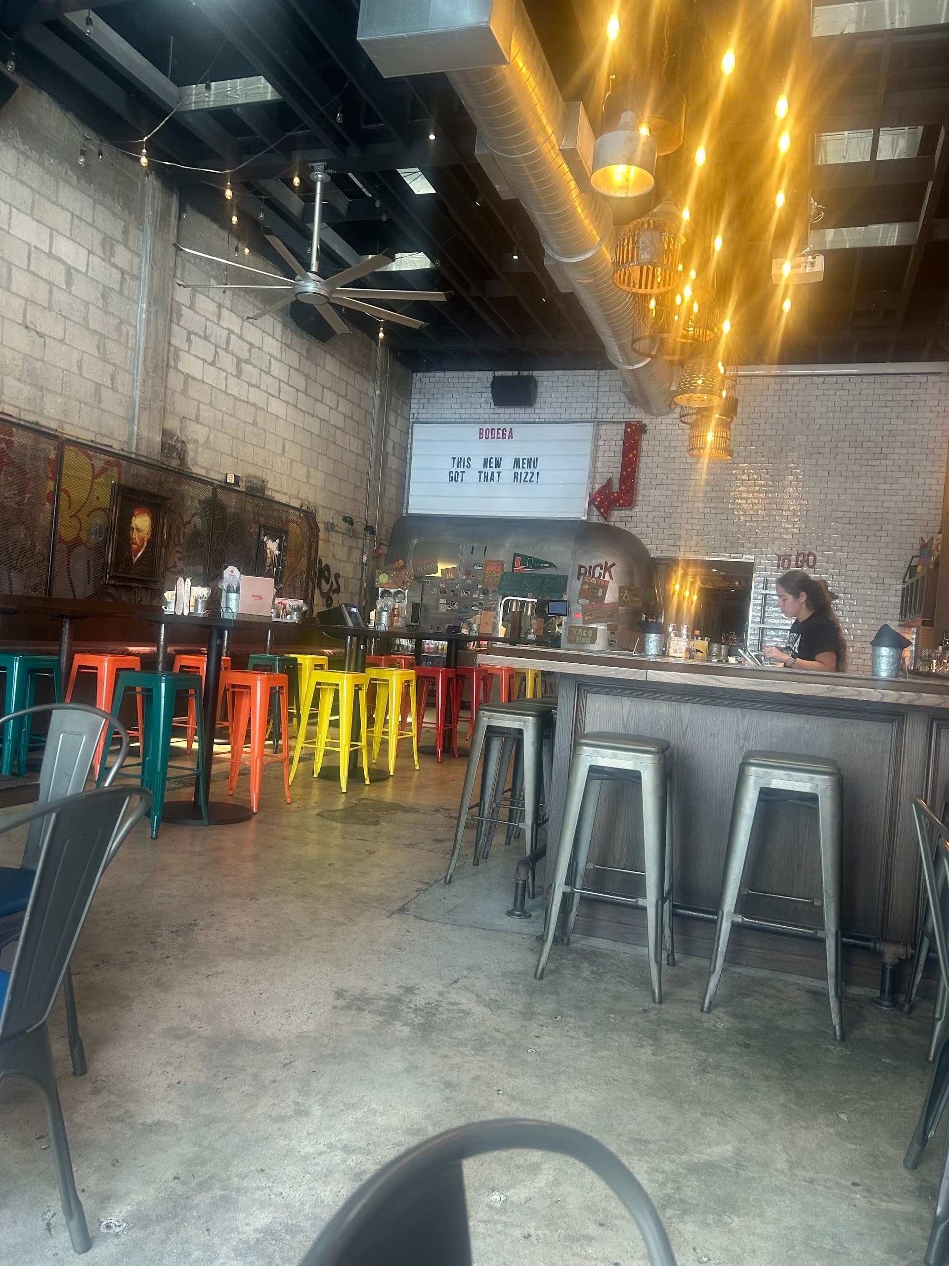 Bodega Bar Coral Gables interior with colorful seating
