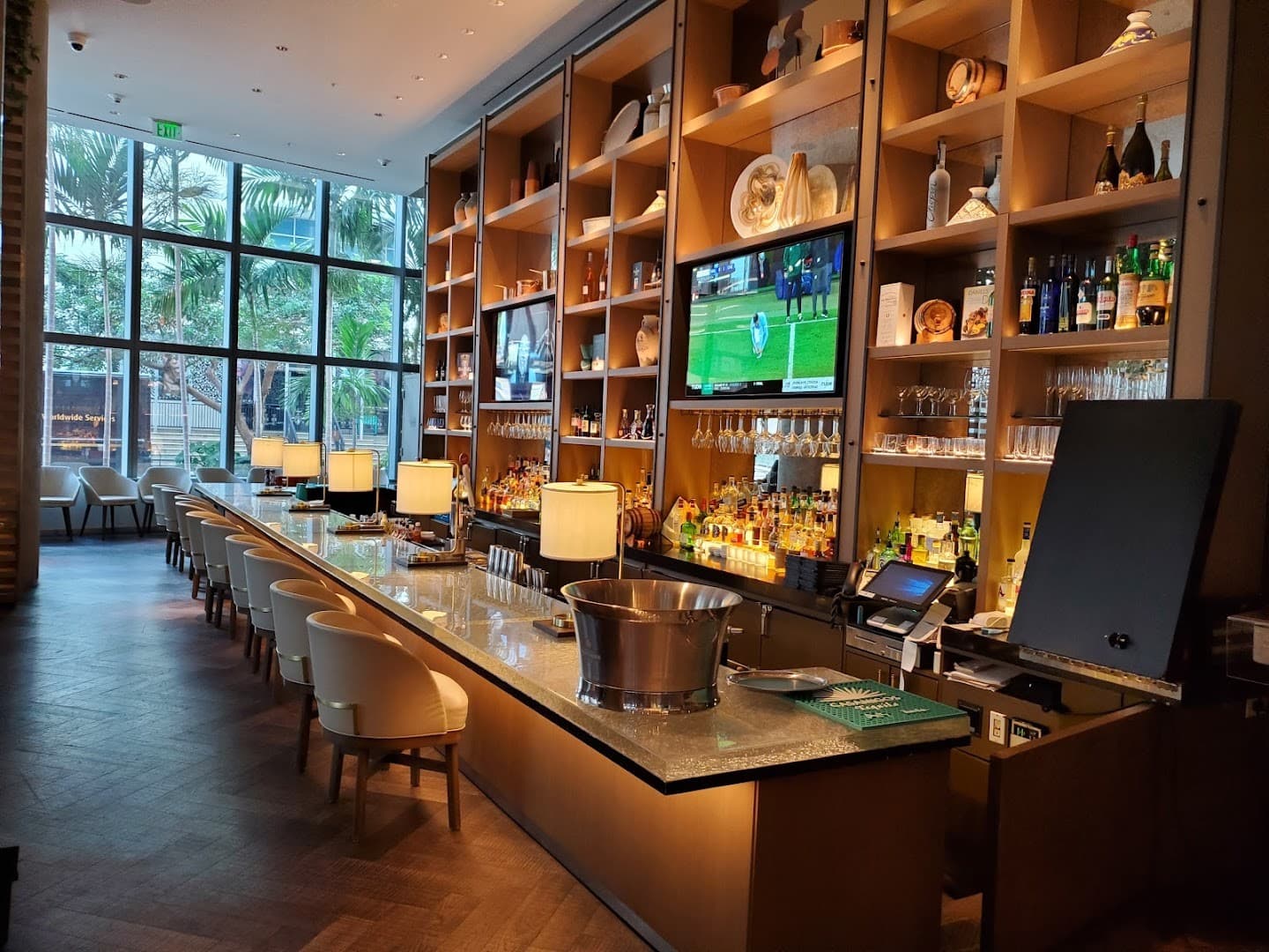 Boulud Sud Miami bar interior with drinks