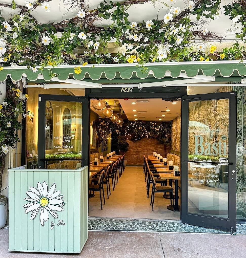 Café Bastille Downtown Miami exterior entrance with flowers