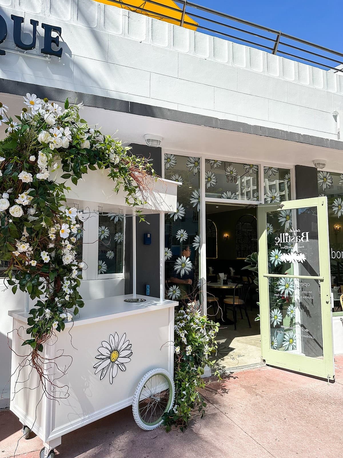 Café Bastille Miami Beach outdoor view with floral decor