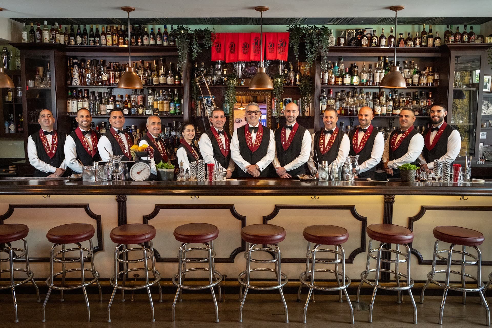 Staff at Cafe La Trova in Miami showcasing bartending skills