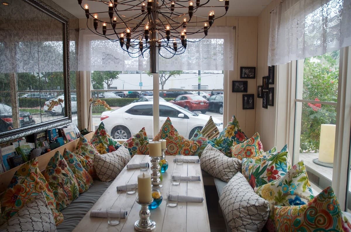 Cozy interior seating at Call Me Gaby in Miami Beach