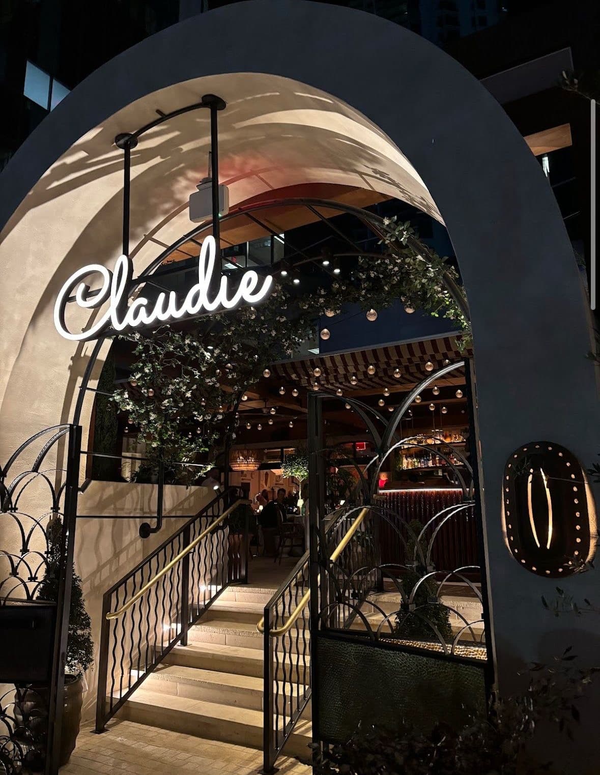 Entrance of Claudie restaurant in Miami at night