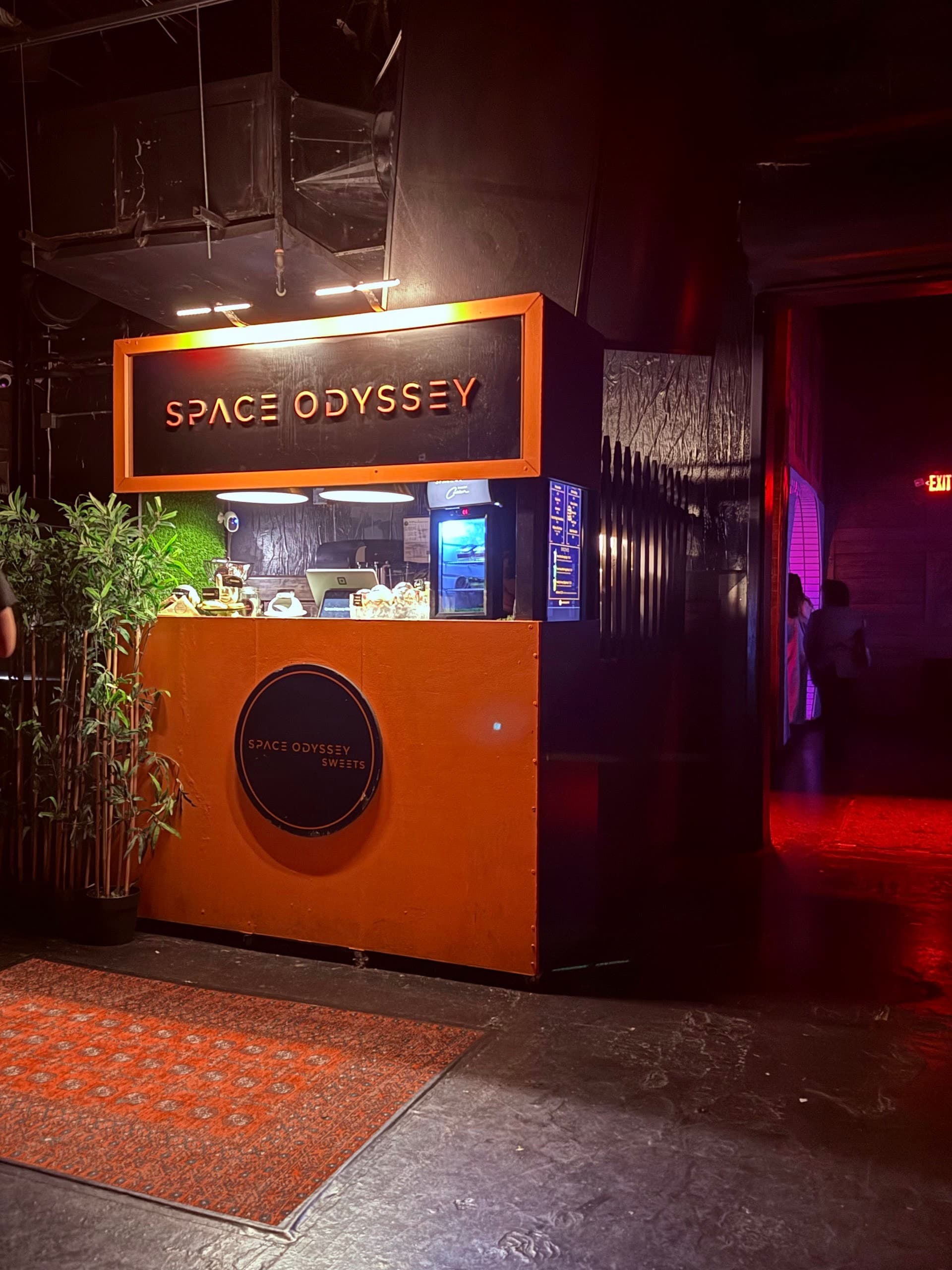 Bar area of Club Space in Miami with signage