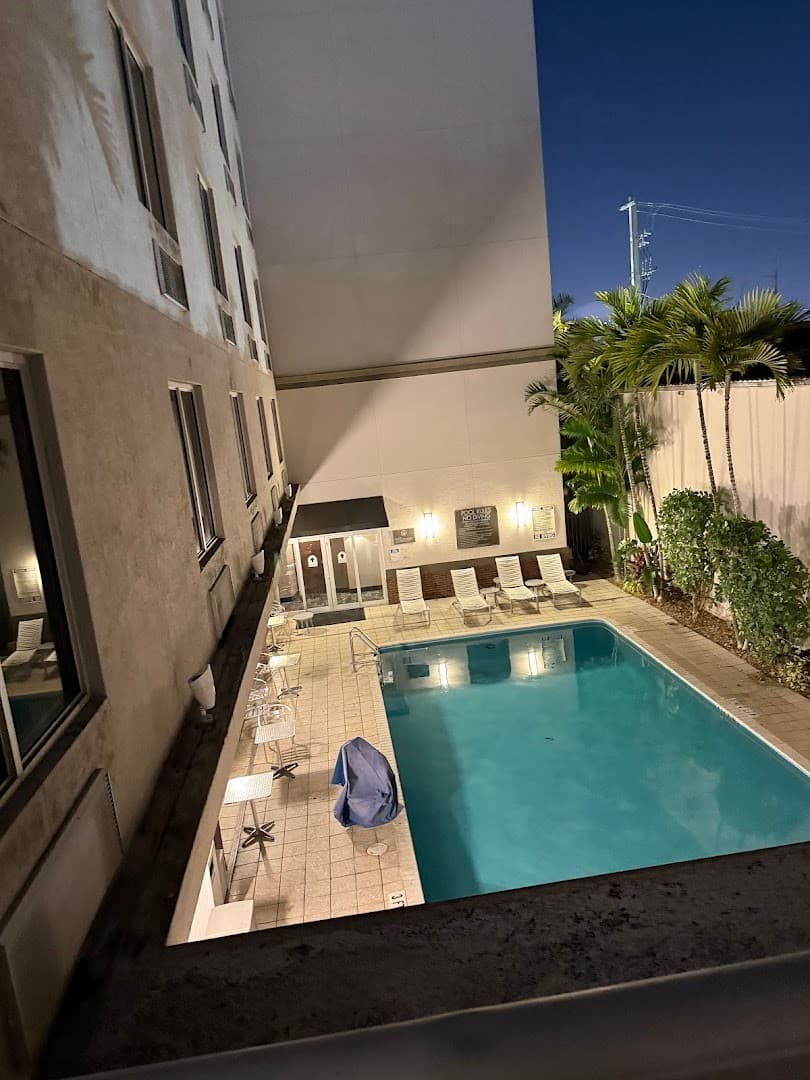 Comfort Suites Miami Airport North pool area at night