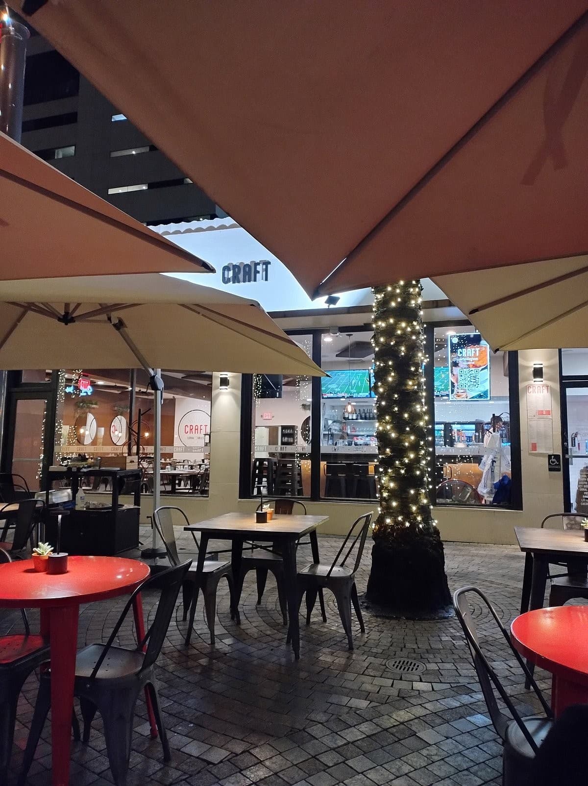 CRAFT Coral Gables outdoor seating area at night