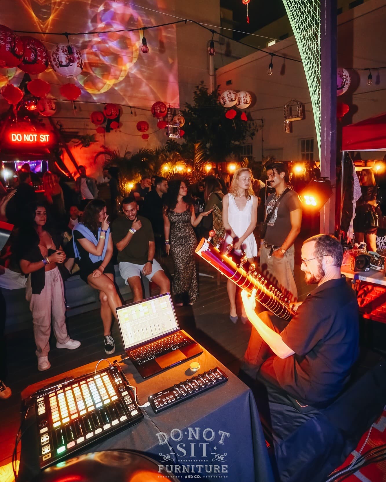 Vibrant nightlife at Do Not Sit On The Furniture, Miami Beach