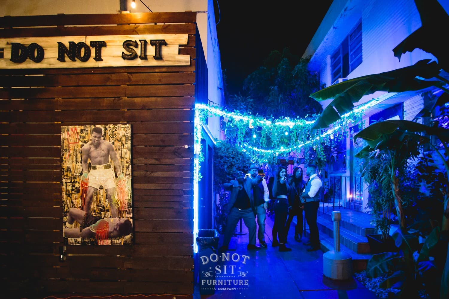 Do Not Sit On The Furniture patio scene Miami Beach