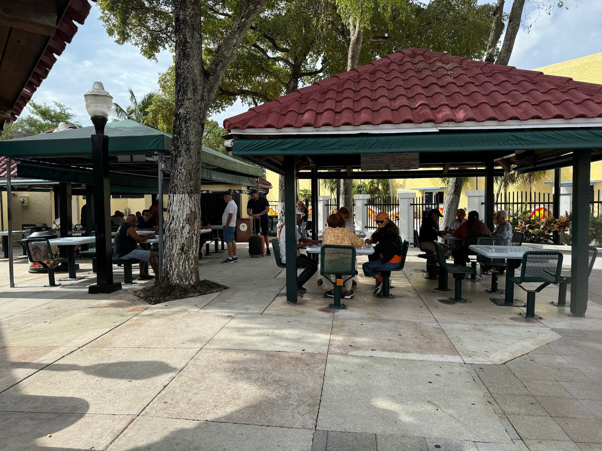 Outdoor seating at Domino Park in Miami with visitors