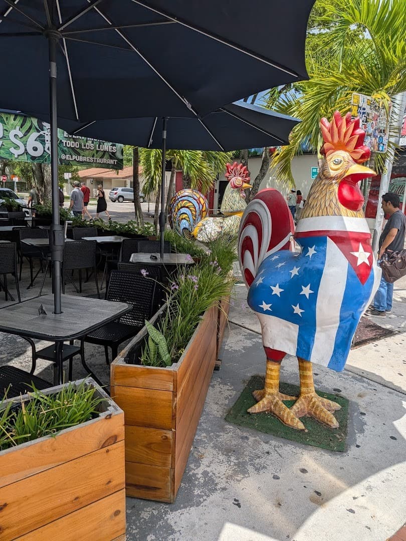 Colorful rooster statue at Domino Park in Miami