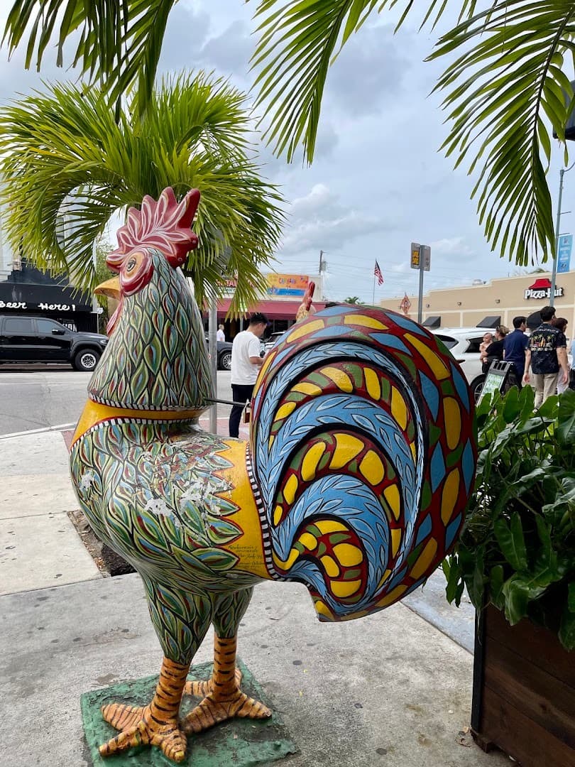 Colorful rooster sculpture at Domino Park in Miami