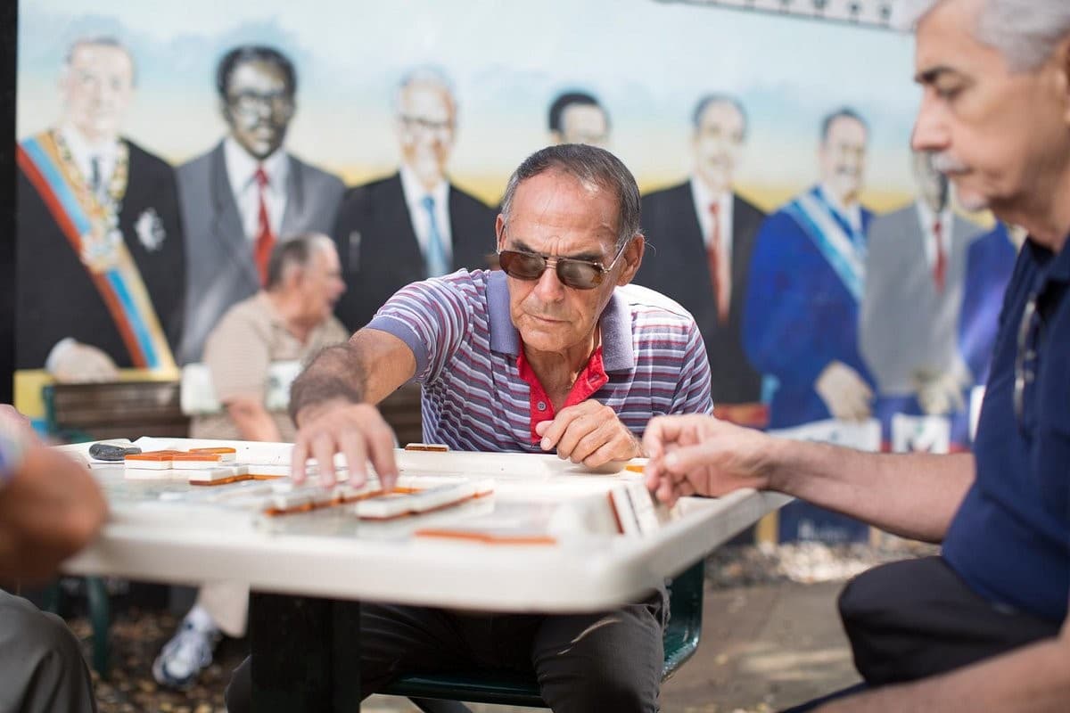 People playing dominoes at Domino Park in Miami