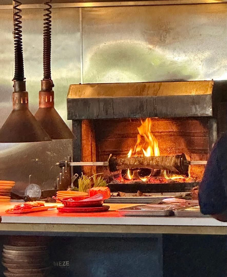 Doya restaurant interior with fireplace in Miami