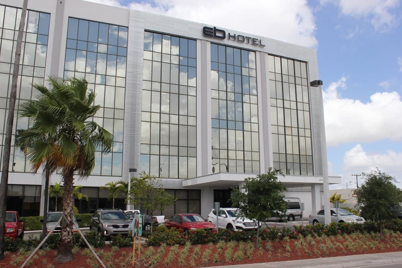 EB Hotel Miami exterior view with palm trees