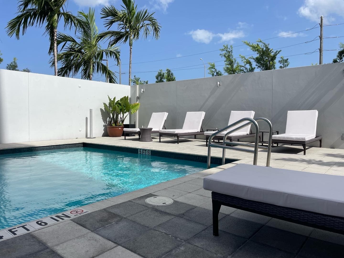 EB Hotel Miami pool area with lounge chairs