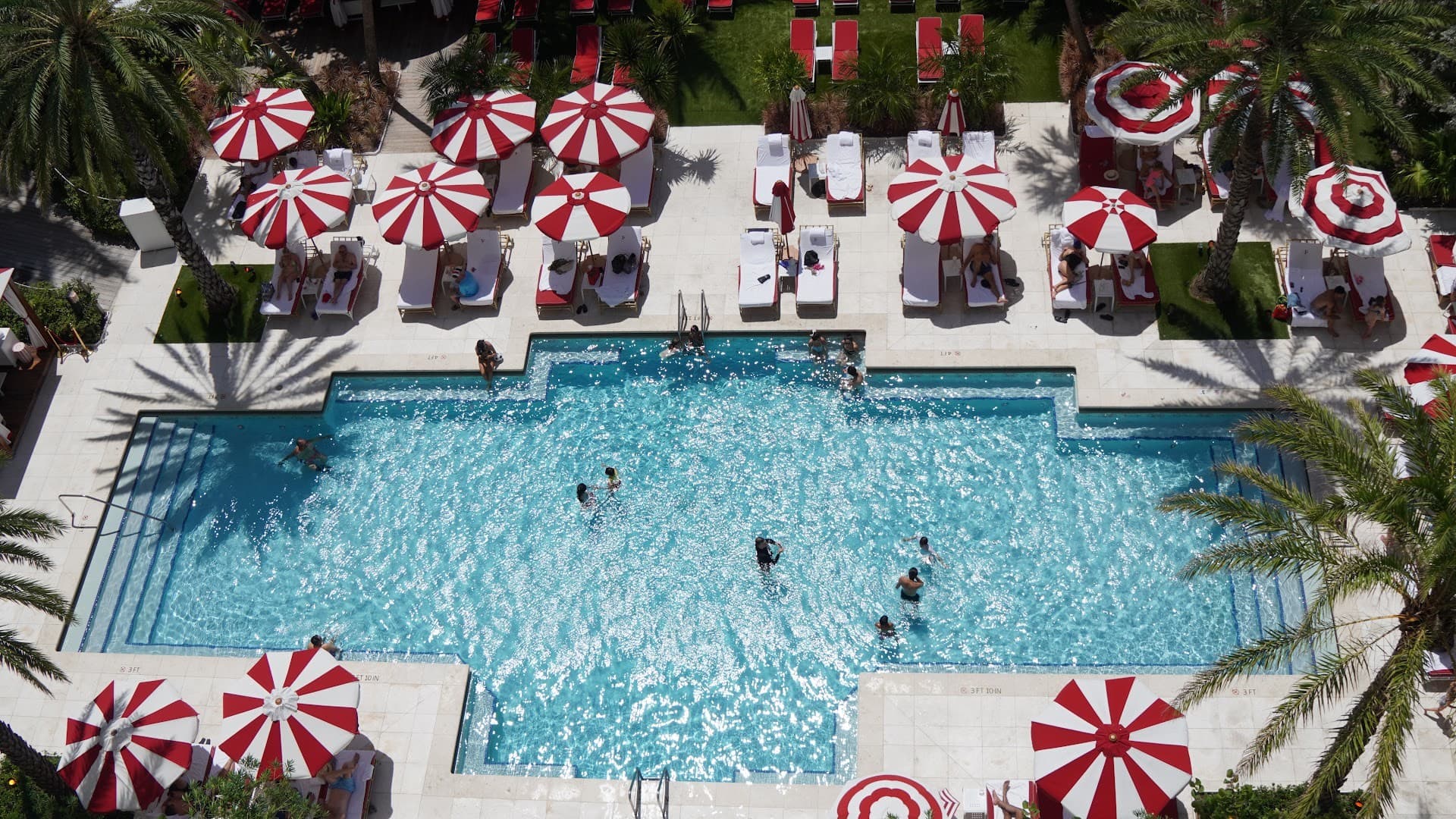 Pool area of Faena Hotel Miami Beach featuring cabanas