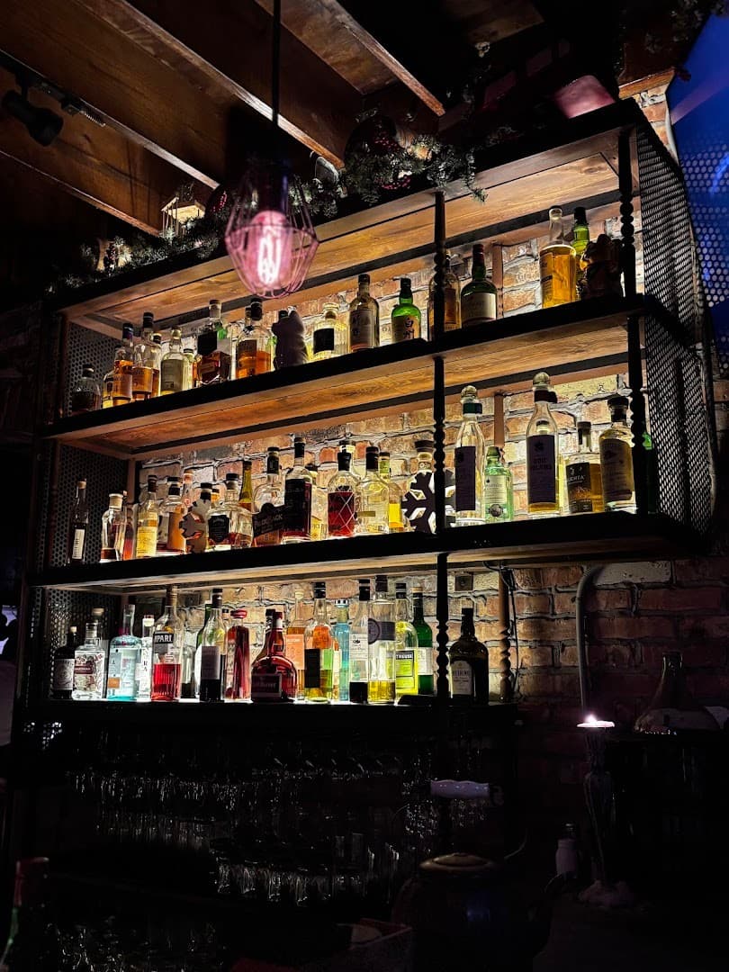 Finka Table & Tap bar shelf with colorful bottles in Miami