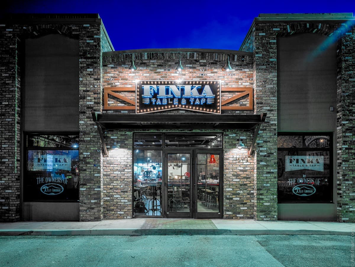 Finka Table & Tap restaurant exterior at night in Miami