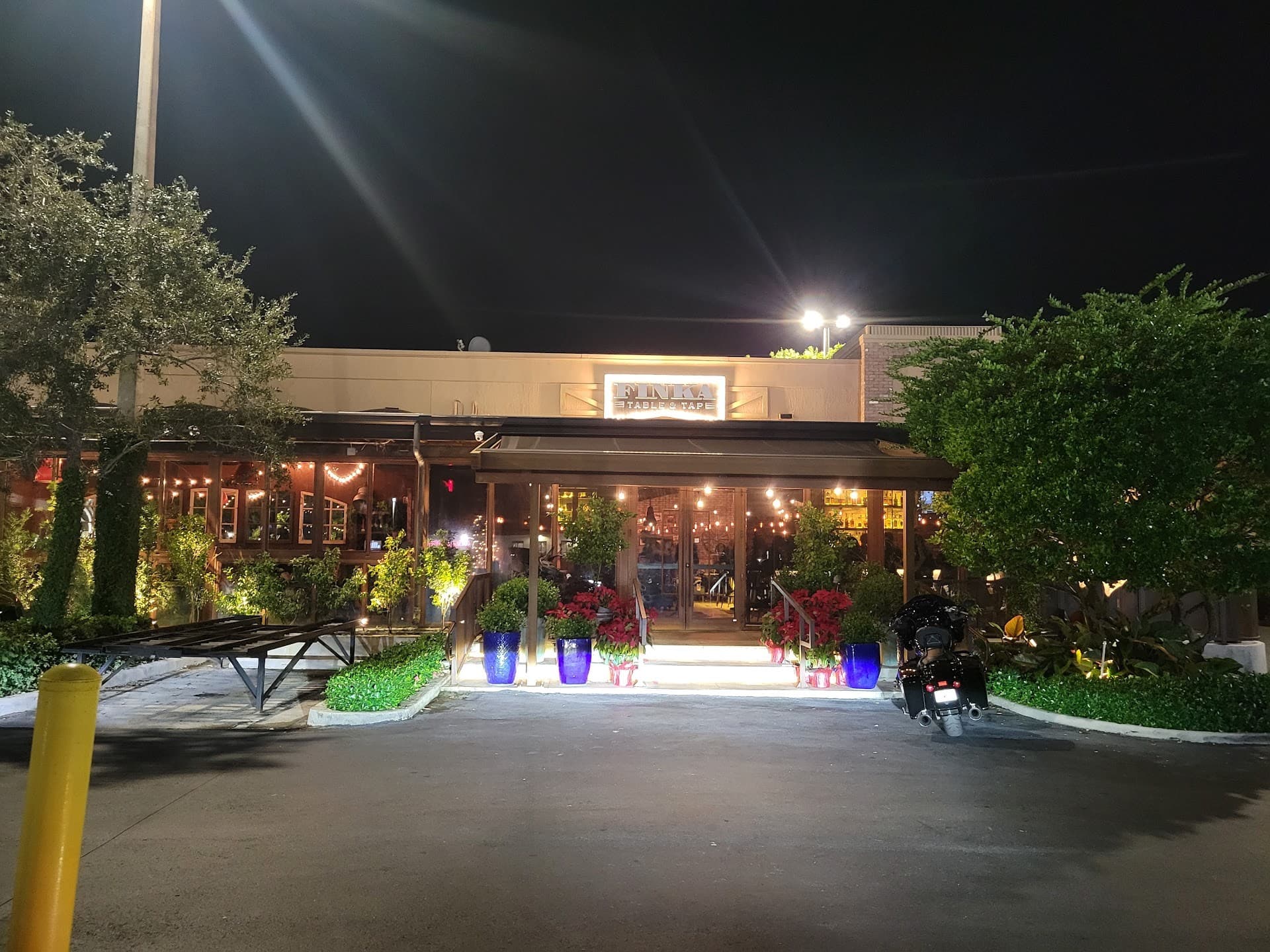 Finka Table & Tap exterior at night in Miami