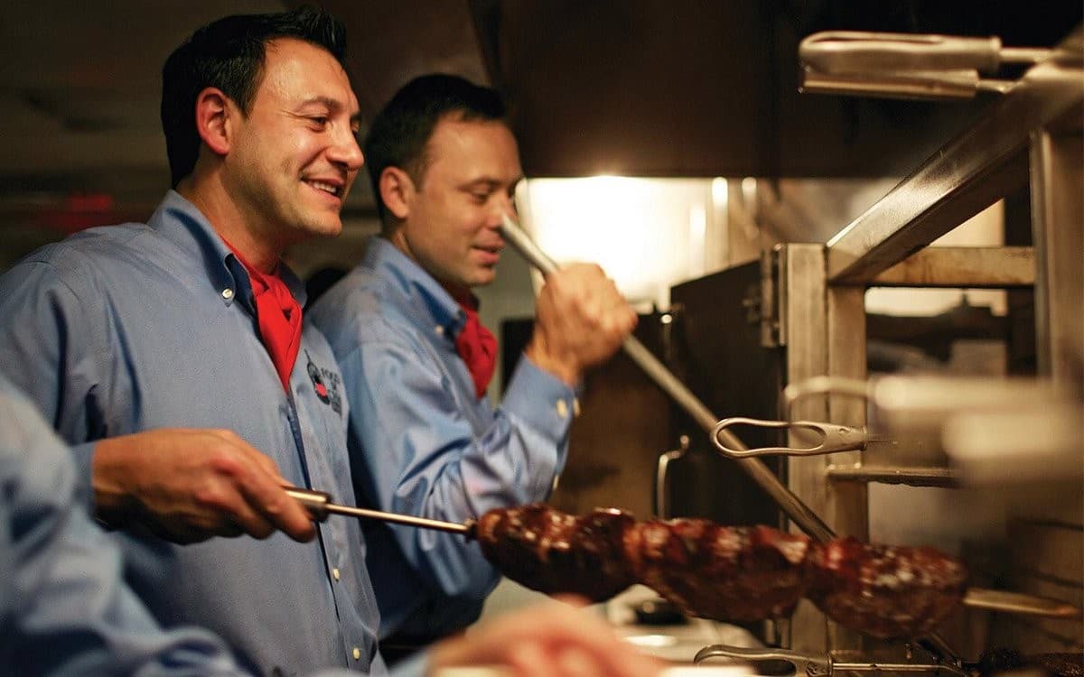 Fogo de Chão Brazilian Steakhouse staff grilling in Coral Gables