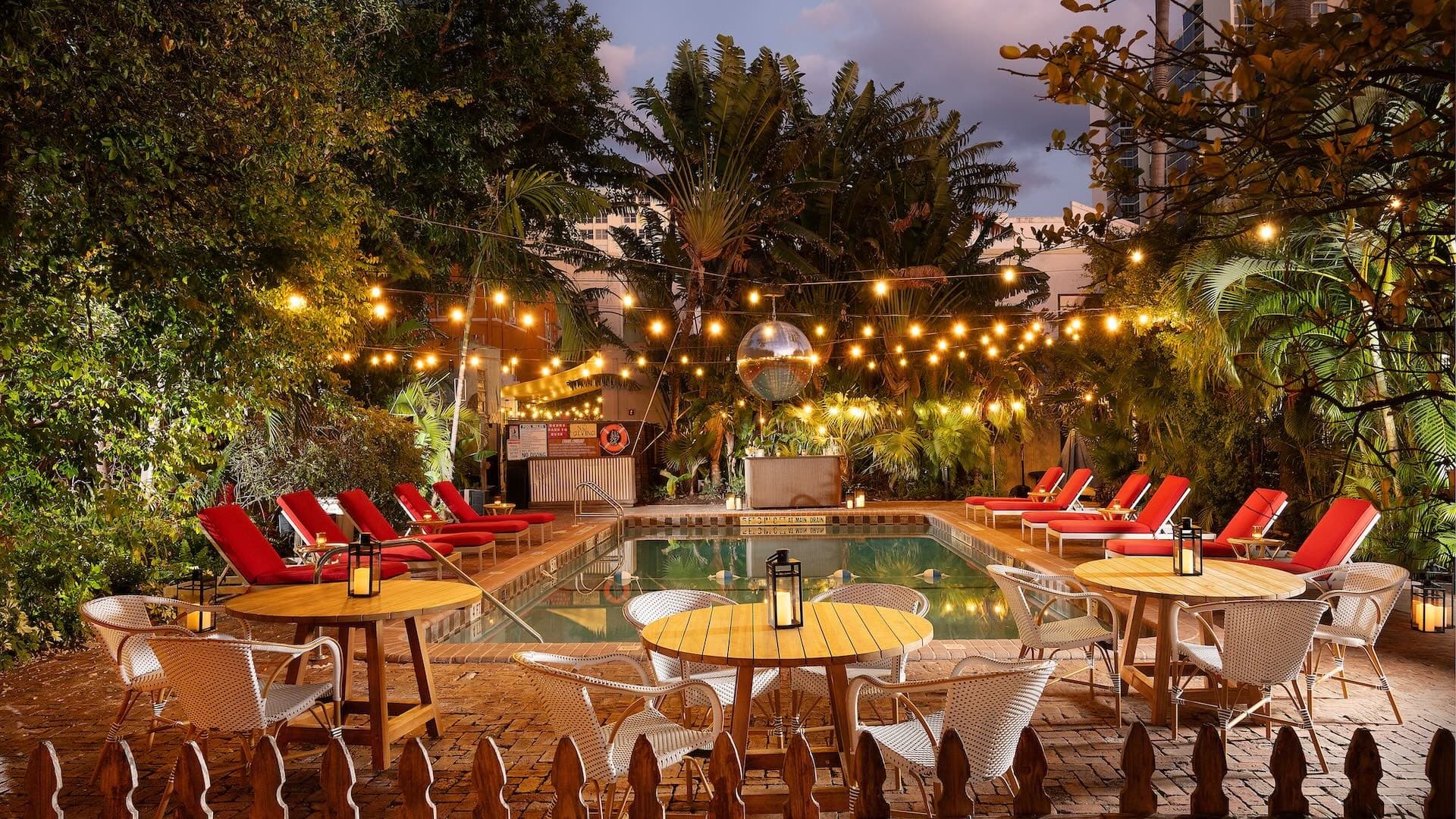 Freehand Miami pool area with lounge chairs and lights