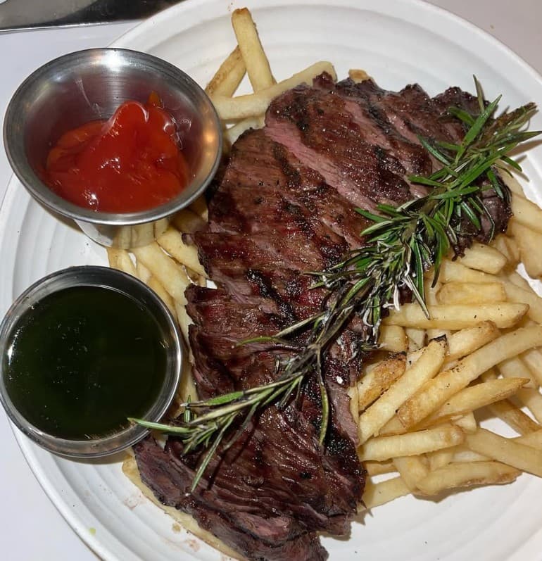Steak and fries at Glass & Vine in Miami