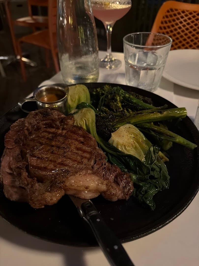 Steak and vegetables at Glass & Vine in Miami