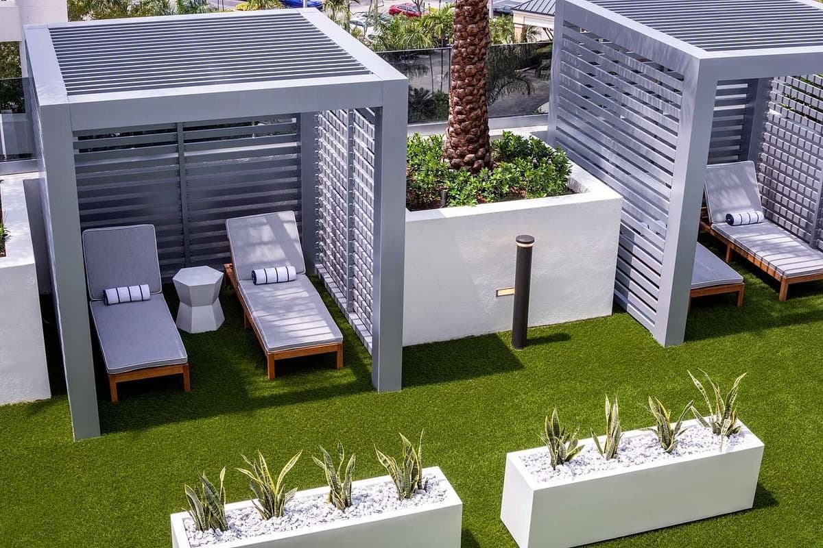 Outdoor cabanas and lounge area at Hilton Miami Aventura