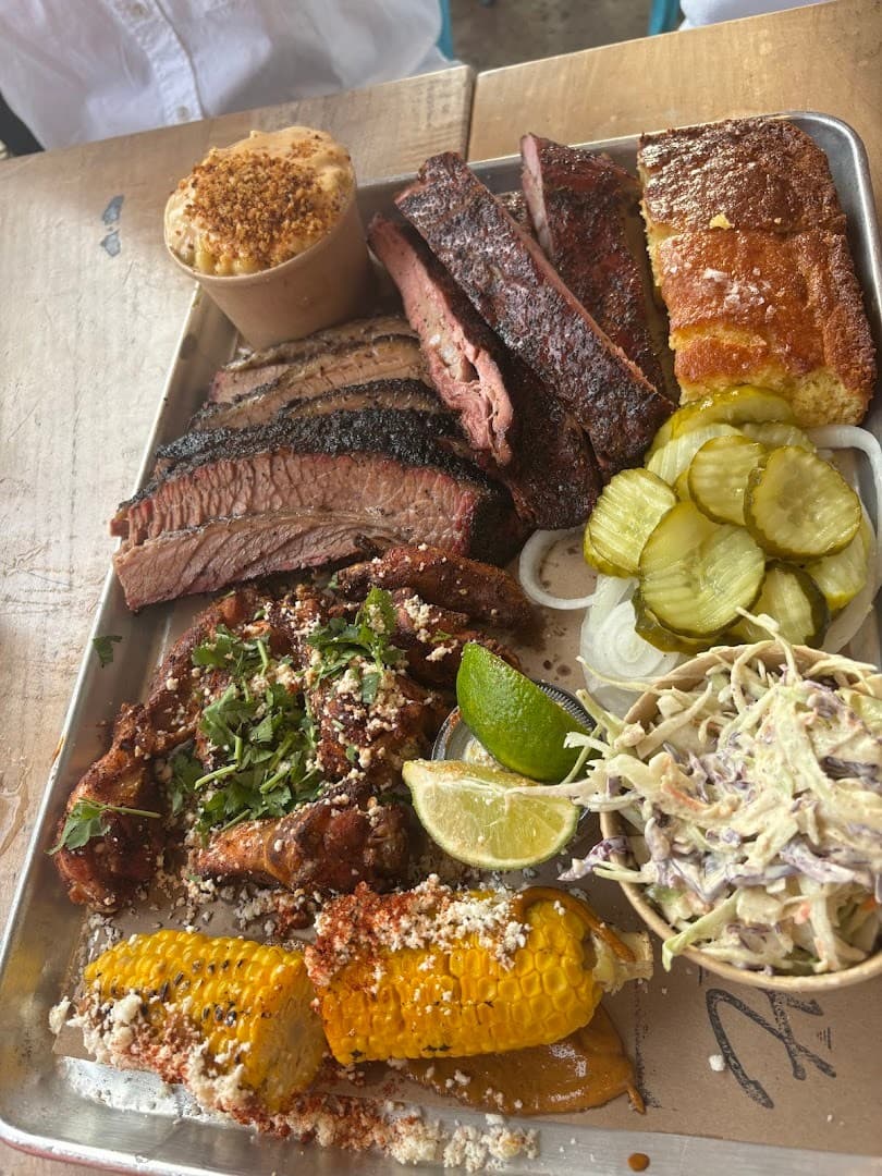 Hometown Barbecue platter with meats and sides in Miami