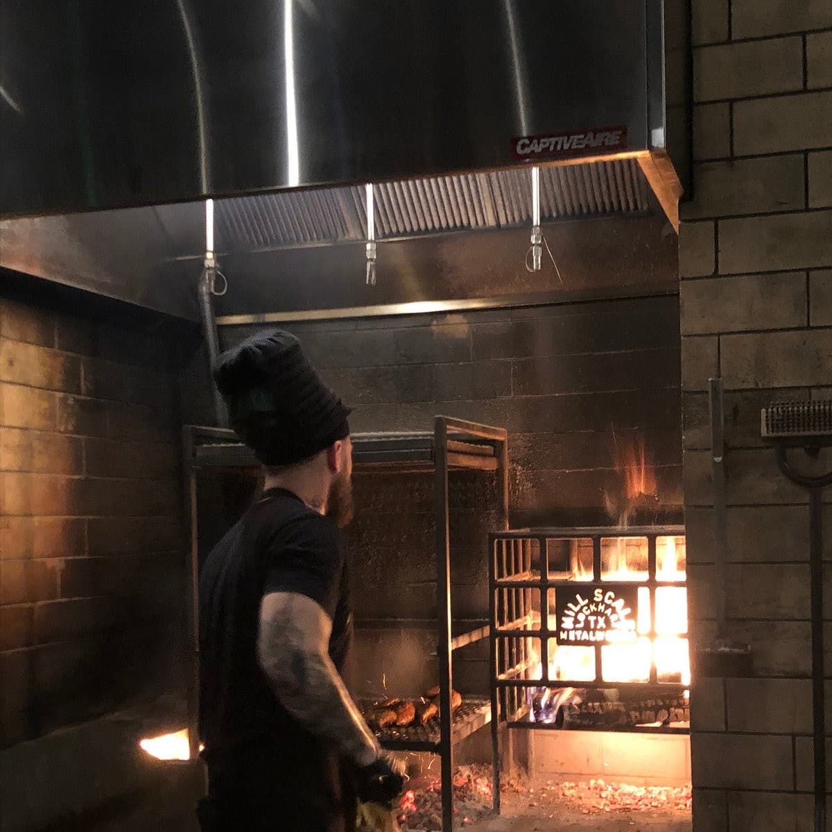 Chef grilling at Hometown Barbecue in Miami