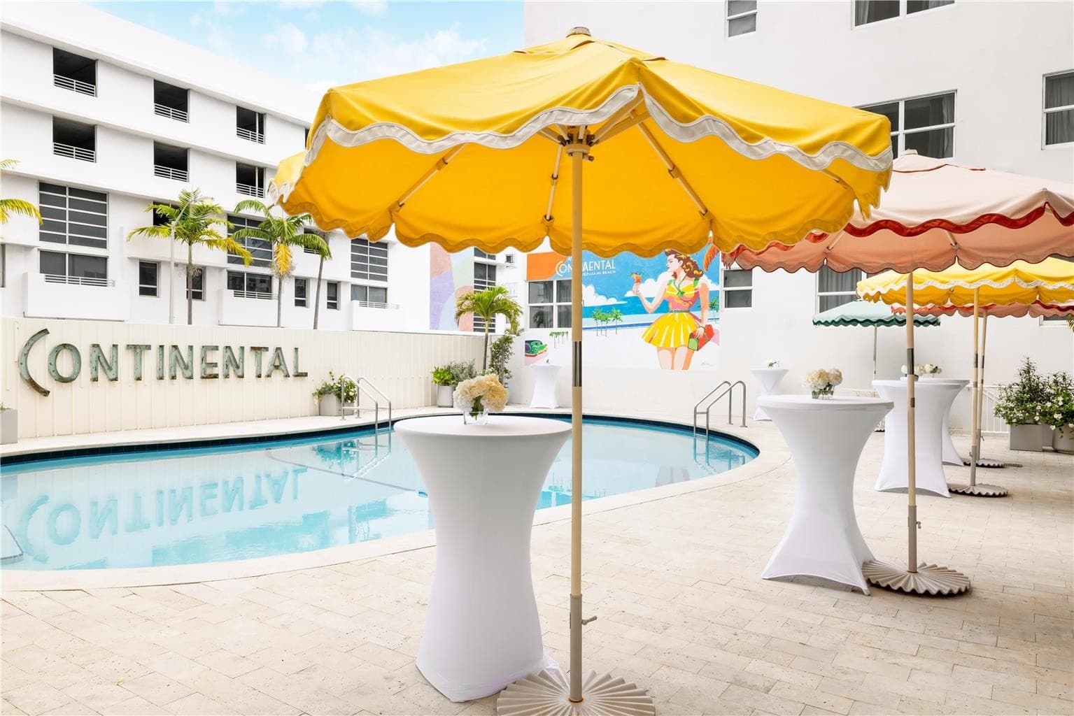 Hotel Continental Miami Beach pool area with vibrant umbrellas