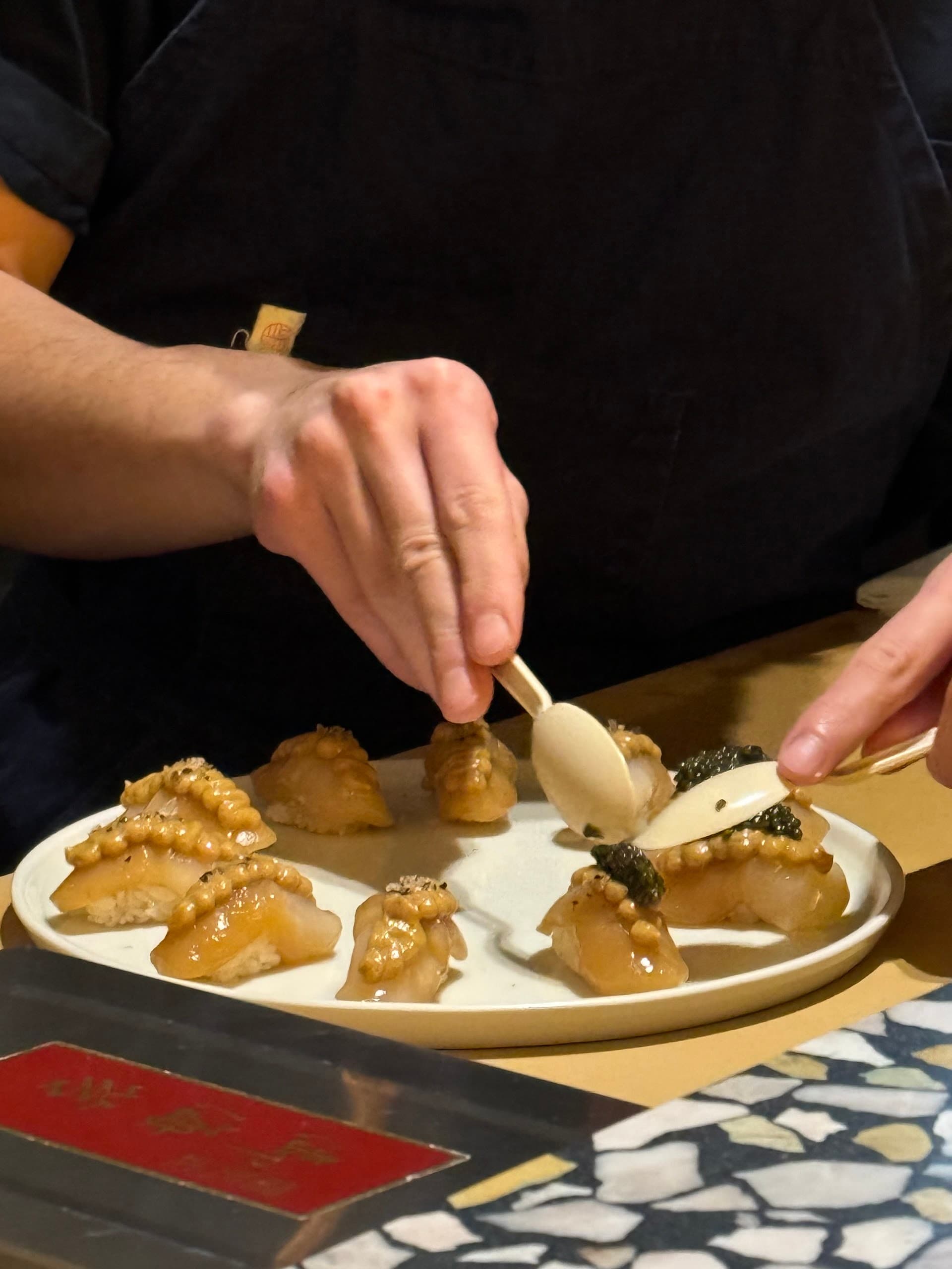 Chef preparing sushi at Itamae AO in Miami