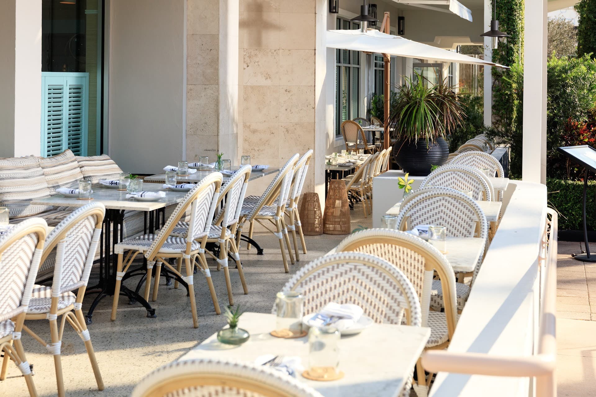 Outdoor dining area at Kimpton Surfcomber Hotel in Miami Beach