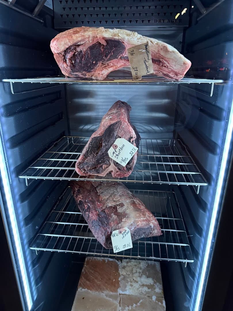 Dry-aged meats display at Klaw Miami