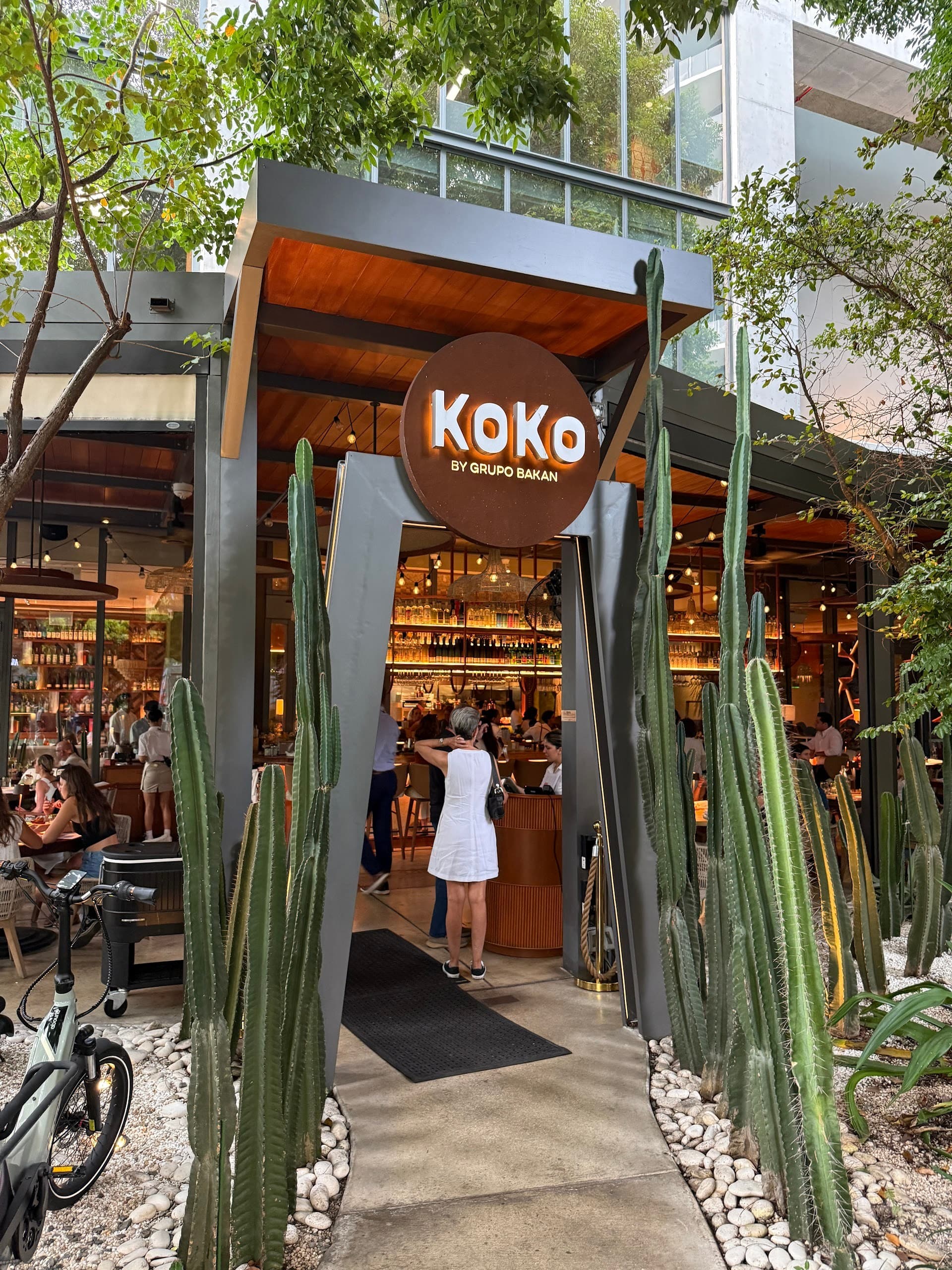 Koko restaurant exterior in Miami with signage and greenery