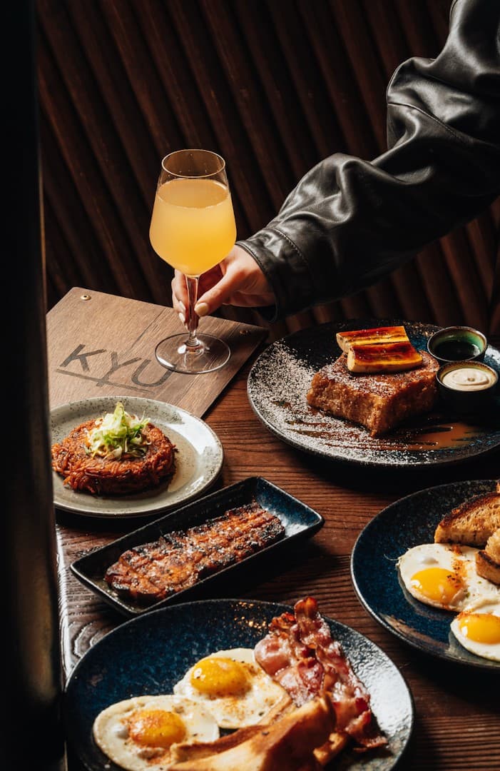 Dining scene at KYU Miami with delicious food