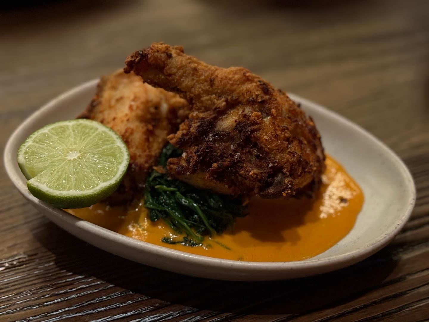 Fried chicken dish at KYU Miami