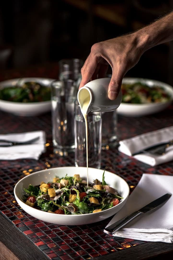 Salad being served at La Leggenda Pizzeria in Miami Beach