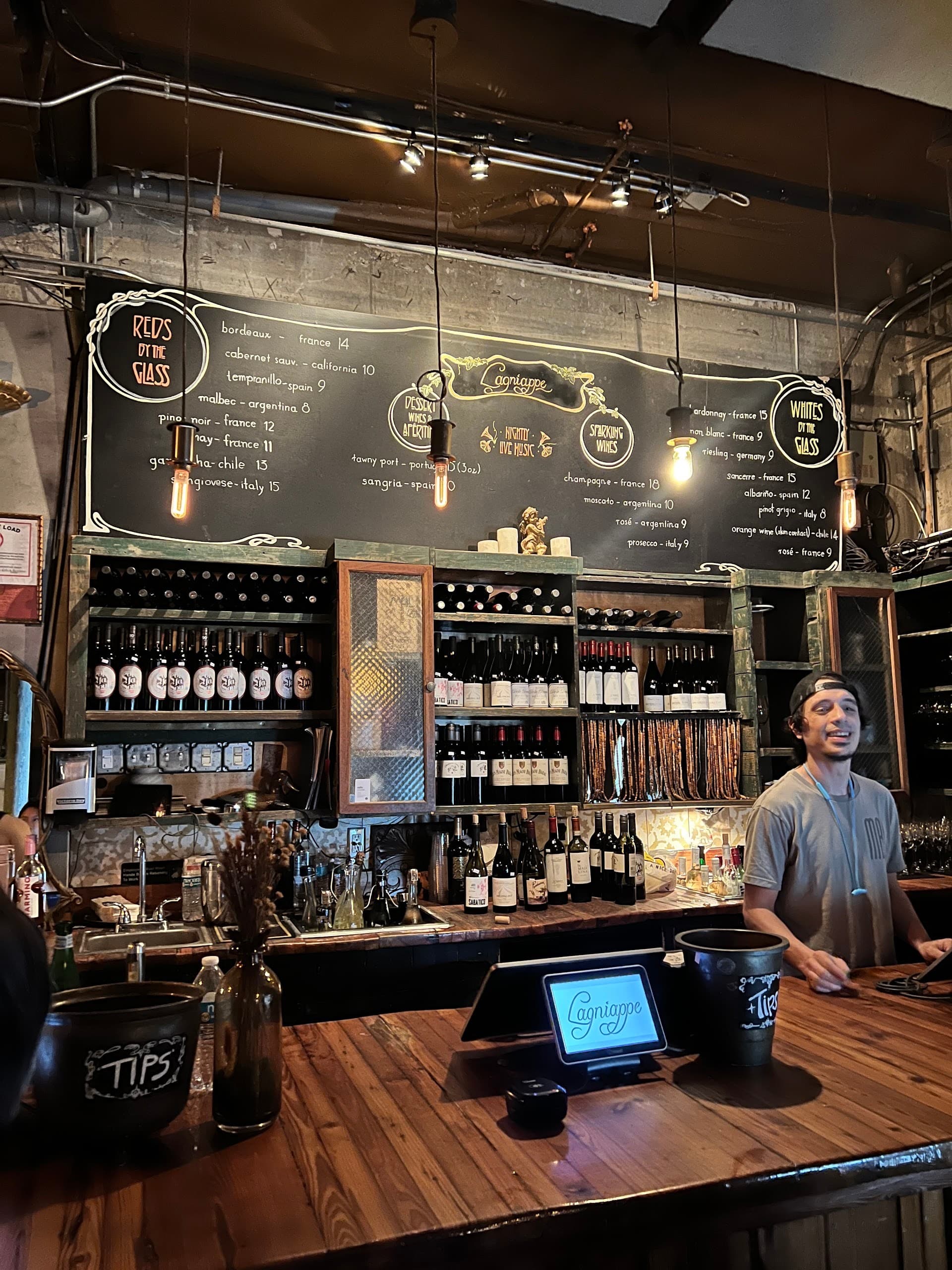 Bar area at Lagniappe in Miami with menu