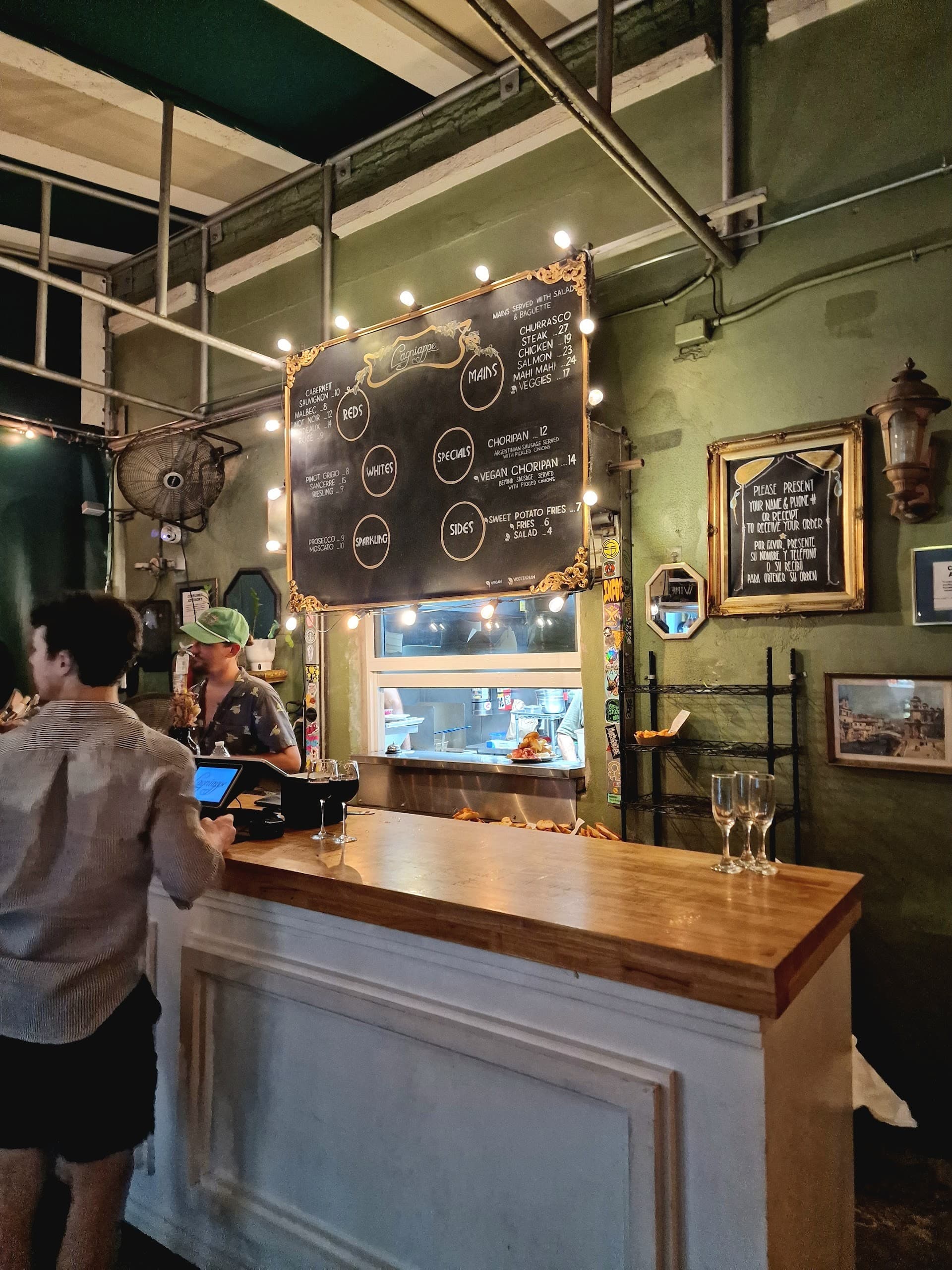 Lagniappe restaurant interior in Miami with a menu board