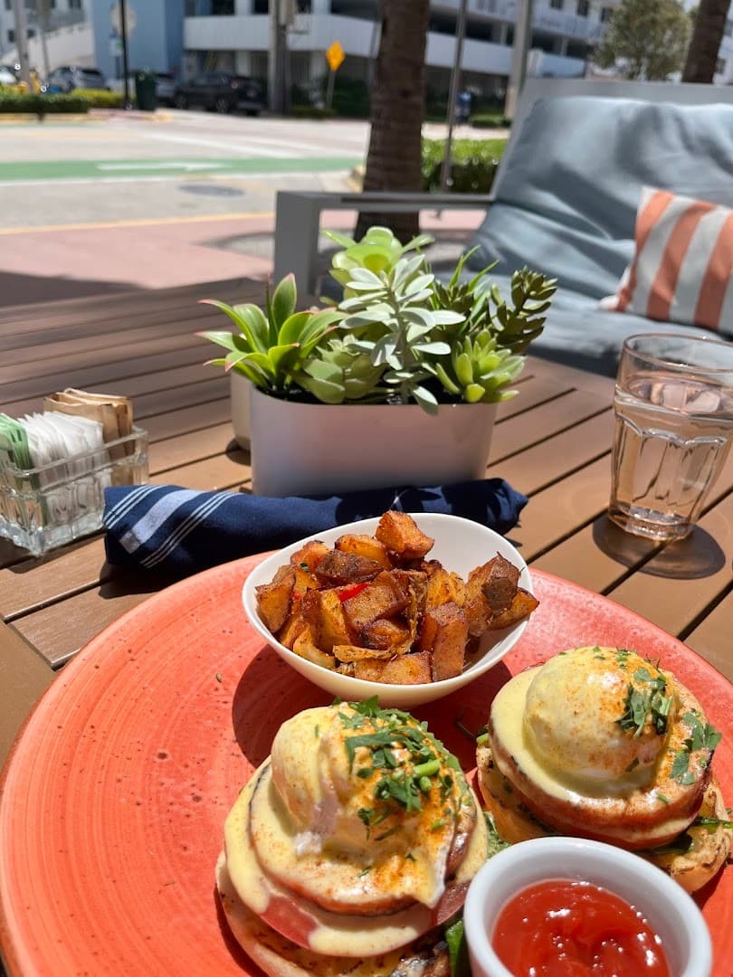 Eggs Benedict and potatoes at Local House Miami Beach