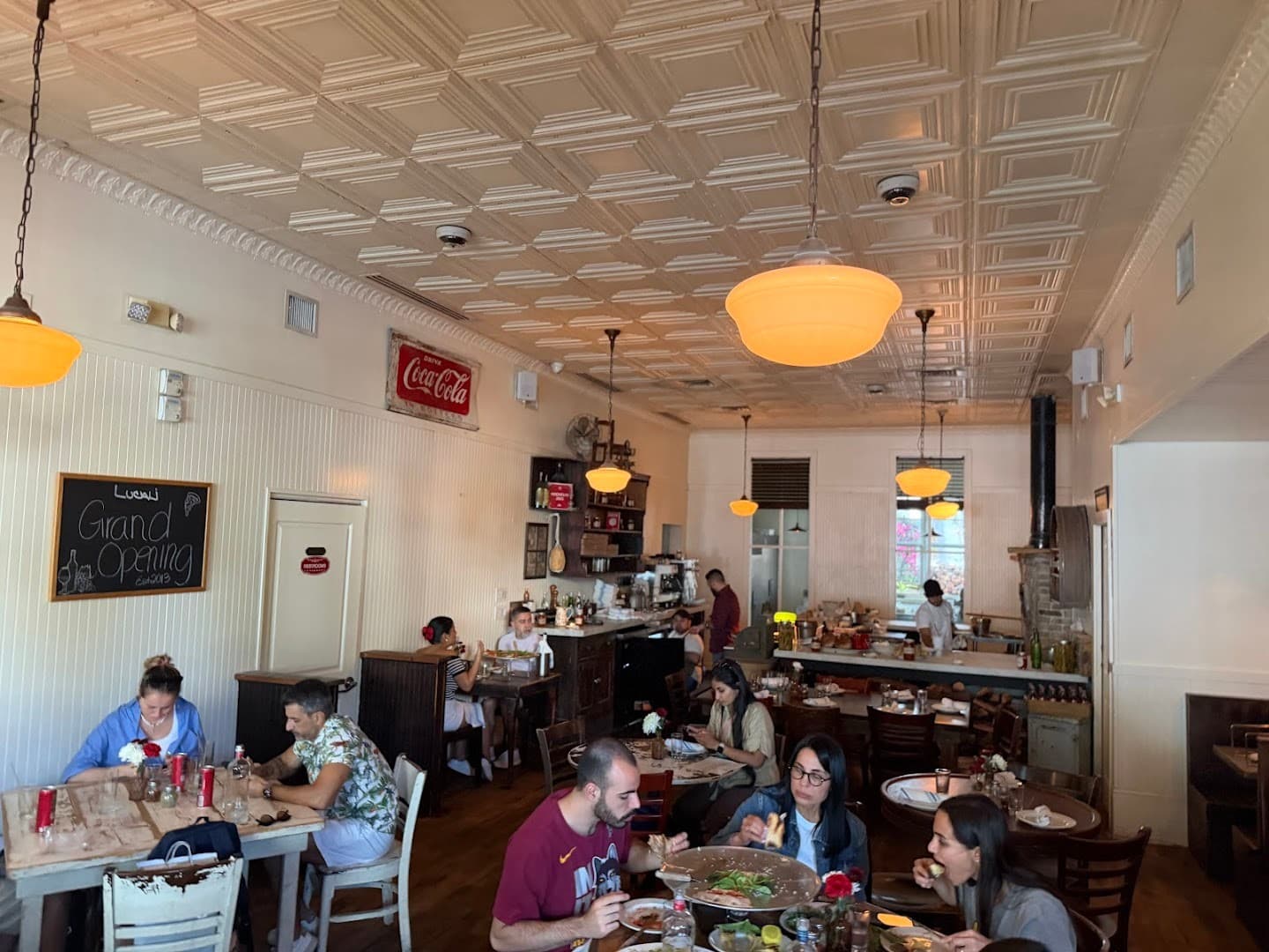 Lucali restaurant interior dining scene in Miami Beach